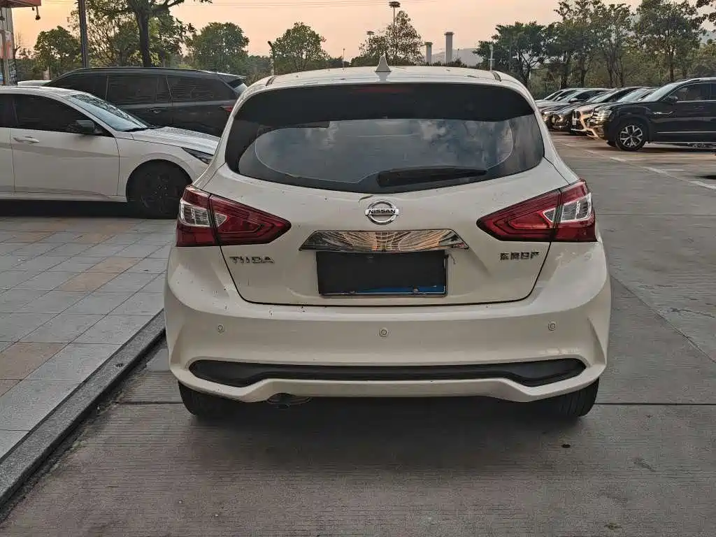 Nissan Tiida — фото 10