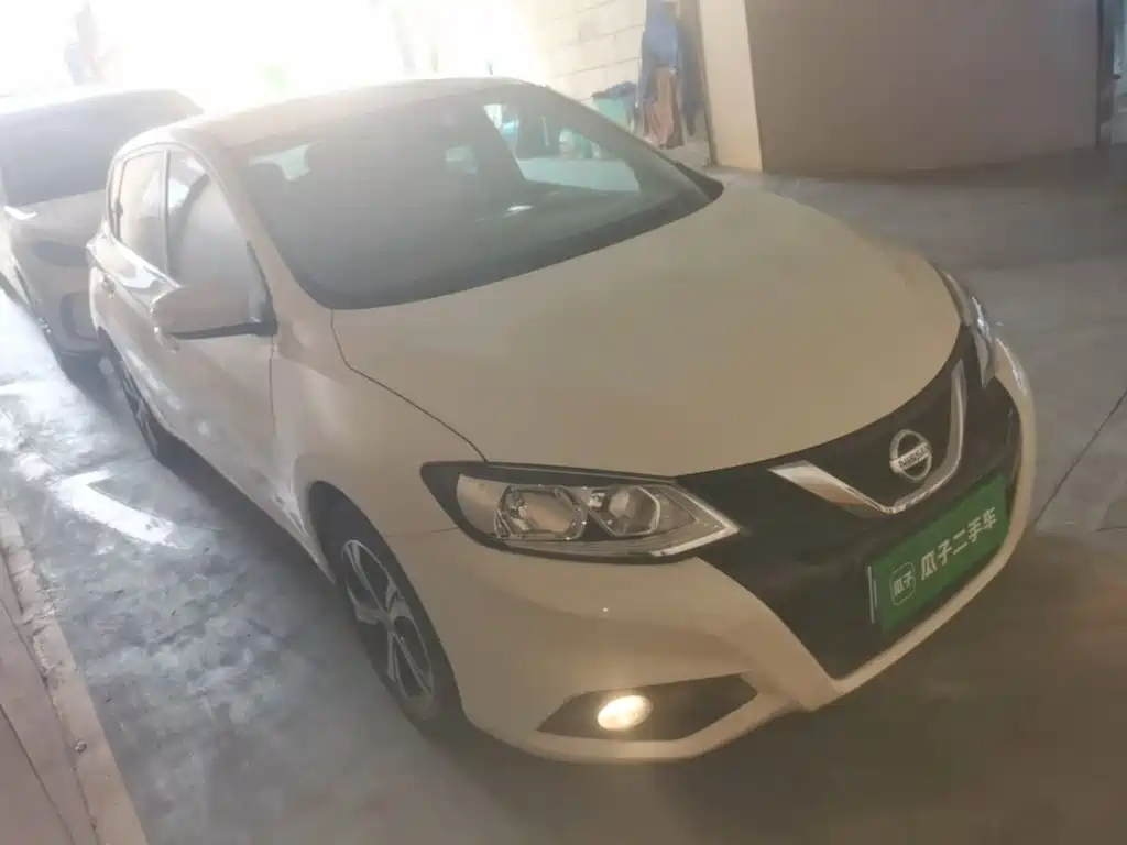 Nissan Tiida — фото 11