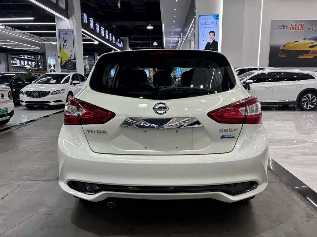 Nissan Tiida — фото 14