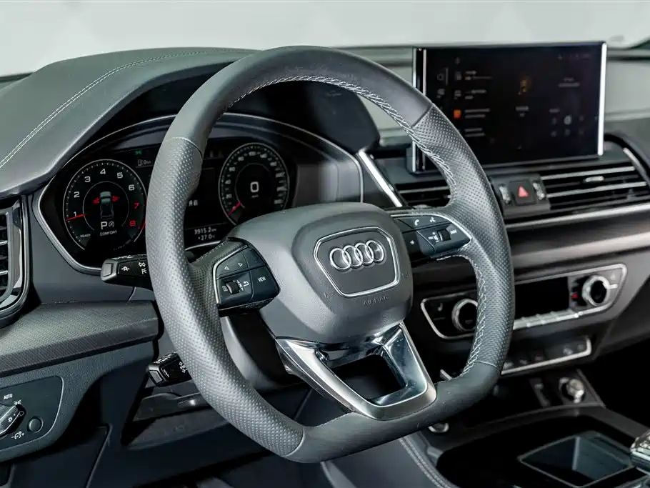 Audi Q5L — фото 11