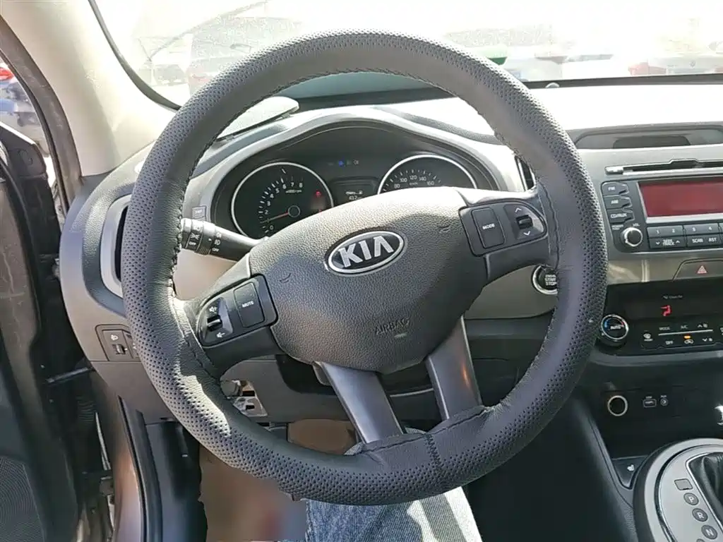 Kia Sportage — фото 11