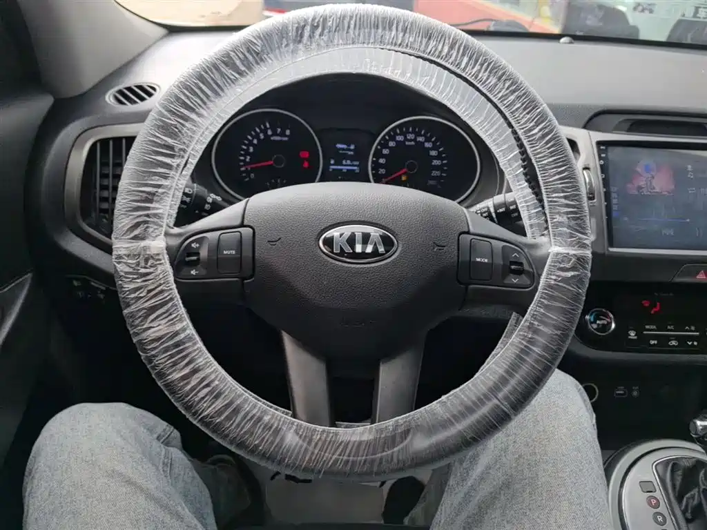 Kia Sportage — фото 11
