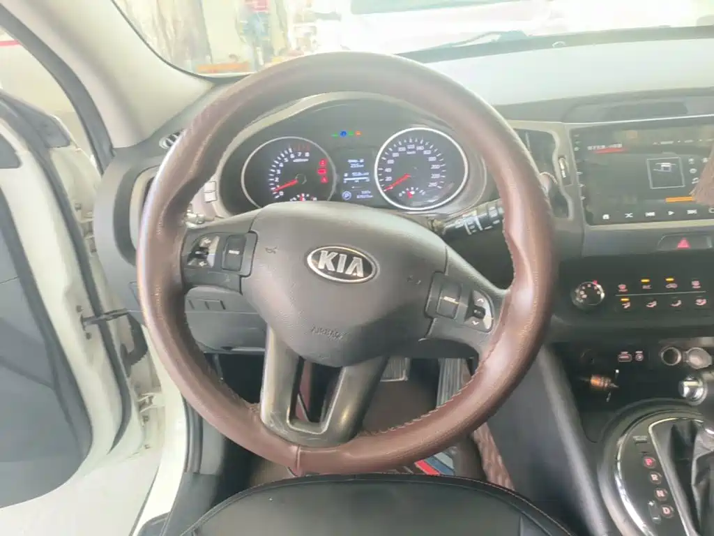 Kia Sportage — фото 11