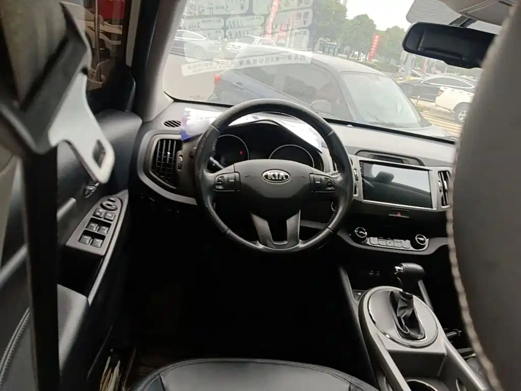 Kia Sportage — фото 11