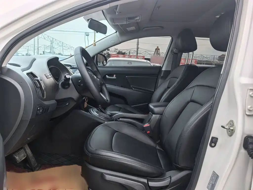 Kia Sportage — фото 9